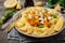 Pasta Mafaldine Napoletane with baked pumpkin, feta cheese and seasoning herbs in ceramic plate on gray concrete old background.