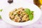 Pasta with meatballs and mushrooms in creamy sauce