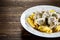 Pasta with meatballs and sauce on wooden table