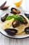 Pasta with mussels , lemons and parmesan closeup