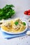 Pasta Nests with Chicken and Creamy Sauce on a Plate, Freshly Cooked Pasta, Tasty Food