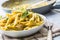 Pasta pene with chicken pieces mushrooms parmesan cheese sauce a
