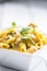 Pasta pene with chicken pieces mushrooms parmesan cheese sauce a