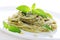 Pasta with pesto sauce, fresh basil and pine nuts