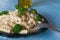 Pasta on plate, blue wooden background