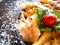 Pasta plate top view, macaroni with cherry tomato, salad and parmesan cheese. Close up food photo