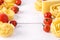 Pasta Products with Tomato Cheese Raw Pasta Fusili Fettuccine Ingredients Italian Food White Background Close Up Copy Space Frame