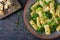 Pasta rigatoni with broccoli and green peas. Vegan menu. Dietary food. Flat lay.