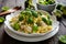 Pasta salad with chicken meat, broccoli, cheese and basil