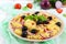 Pasta salad radiatori with chicken, black olives, blue onion, sweet pepper