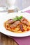 Pasta with sausage and tomato