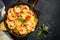 Pasta seafood with shrimp on black table.