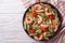 Pasta with shrimp, tomato and pesto sauce. horizontal top view