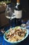 Pasta with small seashells and red wine. Italian traditional cuisine, Seafood for dinner. Copy space