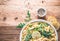 Pasta with a sour cream lemon and herbs on wooden table