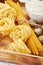 Pasta spaghetti with flour, quail eggs on old wooden background