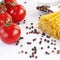 Pasta spaghetti with tomatoes and colorful peppers lies on a white background