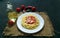 Pasta with spicy tomato sauce, parmesan. Pasta Chiffery Rigati on a black background. Copy space. Top view.