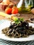 Pasta with squid ink and fresh tomatoes