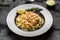 Pasta tagliatelle with shrimps in creamy sauce and thyme, fettuccine pasta. Italian food, top view