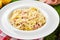 Pasta tagliatelli carbonara. Traditional italian dish of pasta with pancetta, ham, egg, hard parmesan cheese and cream sauce