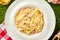 Pasta tagliatelli carbonara. Traditional italian dish of pasta with pancetta, ham, egg, hard parmesan cheese and cream sauce