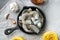 Pasta taglierini with pesto sauce and shrimps ingredients, on gray stone background, top view flat lay