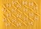 Pasta texture. Several Penne and Farfalle arranged on Spaghetti background