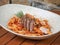 Pasta with tomato sauce and lamb