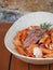 Pasta with tomato sauce and lamb