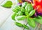 Pasta, tomatoes, and basil on wooden background