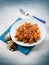 Pasta with tomatoes dried grape and pine nuts