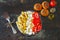 Pasta with tomatoes and white cheese. Vegetarian bowl with pasta, tomatoes and feta.