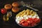 Pasta with tomatoes and white cheese. Vegetarian bowl with pasta, tomatoes and feta.