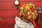 Pasta Tortiglioni with tomato sauce, baked cherry tomatoes, mozzarella and parmesan cheese, basil on old red rustic table. Italian