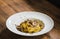 Pasta with truffles.Tagliatelle with black truffle on wooden table.