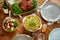 Pasta, vegetable salad and other food on table