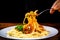 Pasta with vegetable sauce on the fork