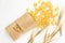 Pasta and wheat spikelets on a white background. Italian food recipes. Top view, flatlay, copy space