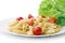 Pasta on a white plate with cherry tomatoes