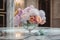 pastel blooms in crystal vase on marble tabletop