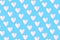 Pastel blue background with white hearts pattern. Minimal love art design