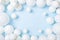 Pastel blue table with white balloons top view. Party or birthday background. Flat lay