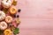 Pastel blush pink and orange mini pumpkins on soft blush pink wooden backdrop. Autumn copyspace background. Generative AI