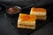 Pastel borracho - typical of Spain,  and hot chocolate on dark background