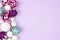 Pastel Christmas bauble side border over purple