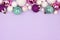 Pastel Christmas bauble top border over purple