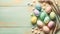 Pastel color easter eggs on turquoise wood background