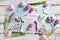 Pastel color easter flat lay with tulips bunnies and greeting text