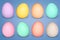 Pastel colored easter eggs against blue background